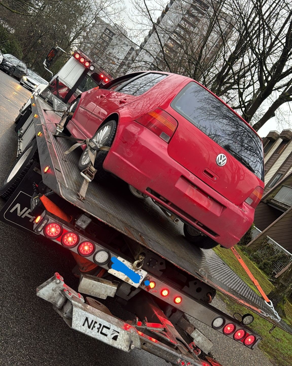 Old car being taken away for recycling in British Columbia